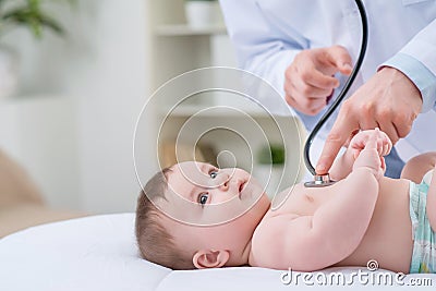 Professional pediatrician examining infant Stock Photo