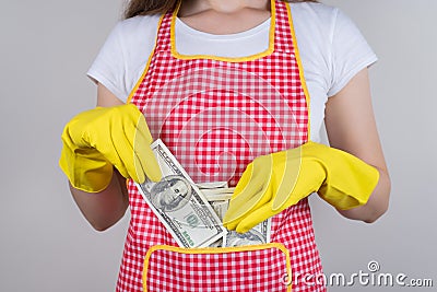 Professional people earn more concept. Cropped close up photo of satisfied happy confident lady putting money into pocket on her Stock Photo