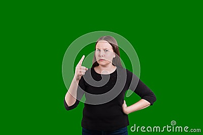 Mad scolding expression on women face waving a pointed finger at the camera Stock Photo