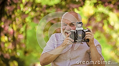 Professional photographer. Capturing moments that captivate your heart. Photographer filming. Perfect frame. Pension Stock Photo