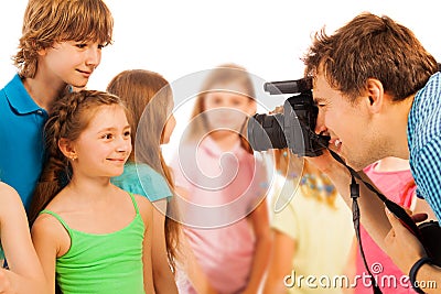 Professional photographer photographing kids Stock Photo