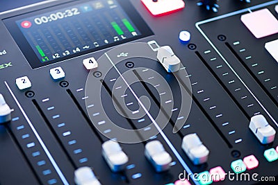 Professional podcast mixing console with faders and adjusting buttons, Audio sound mixer console. Sound mixing desk. Music mixer c Stock Photo