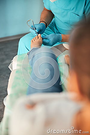 Close up of patient sitting on couch Stock Photo