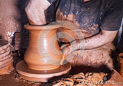 Professional potter making bowl in pottery workshop, studio Stock Photo