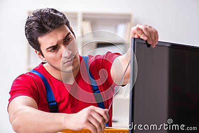 The professional repair engineer repairing broken tv Stock Photo