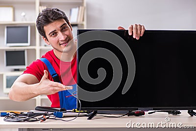 The professional repair engineer repairing broken tv Stock Photo