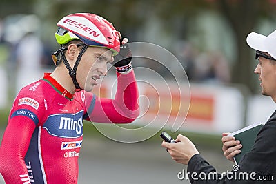 Professional Road Cyclist Evgeny Korolek Poses as a Winner of the International Road Cycling Editorial Stock Photo