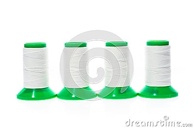 Professional sewing threads on a green industrial roll. Stock Photo