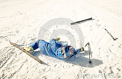 Professional skier after crash accident on skiing resort slope Stock Photo