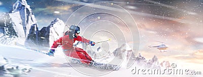 Professional skiing in action. Heli skiing. Motion of the skiing downhill in the mountains. Sportsman in a red ski suit Stock Photo