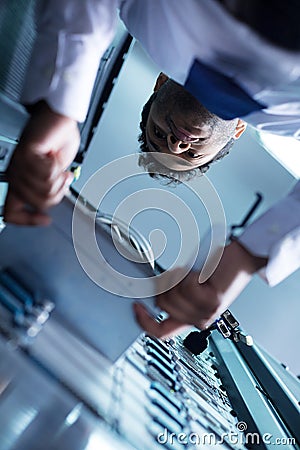Professional skillful technician taking out the blade server Stock Photo