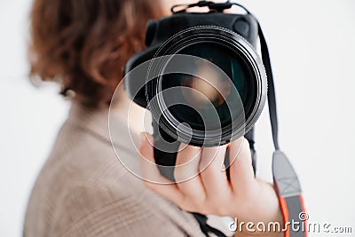 professional SLR camera in women& x27;s hands. fascination with photography Stock Photo