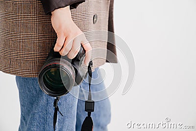 professional SLR camera in women& x27;s hands. fascination with photography Stock Photo