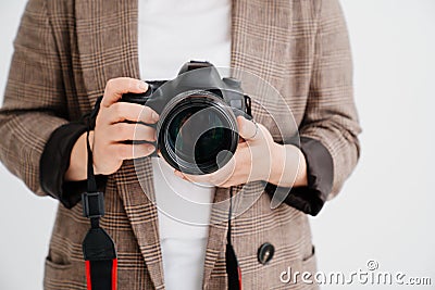 professional SLR camera in women& x27;s hands. fascination with photography Stock Photo