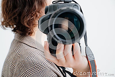professional SLR camera in women& x27;s hands. fascination with photography Stock Photo