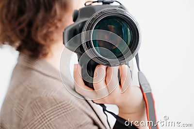 professional SLR camera in women& x27;s hands. fascination with photography Stock Photo