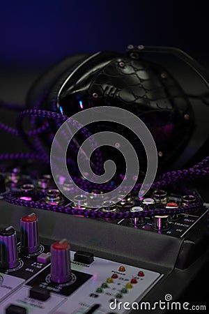 Professional sound and audio mixer and headphones studio lightning with buttons and sliders, selected focus, Stock Photo