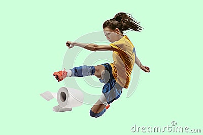 Professional sportswoman caught toiletpaper in motion and action - high demand for essential goods Stock Photo