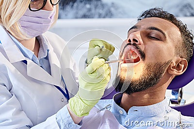 Professional Stomatologist Wrapped up in Work Stock Photo