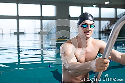 Professional swimmer on the ladder Stock Photo