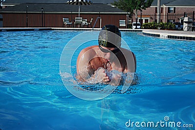 Professional swimmer performing breaststroke Stock Photo