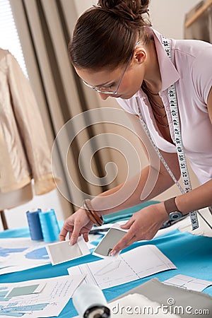 Professional tailor working with fashion sketches Stock Photo