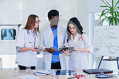 Professional team of multiracial medical doctors having a conference. Multi ethnic group of medical students. Healthcare Stock Photo