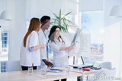 Professional team of multiracial medical doctors having a conference. Multi ethnic group of medical students. Healthcare Stock Photo