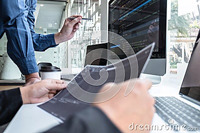 Professional Team of programmer working on project in software development computer in IT company office, Writing codes and data Stock Photo