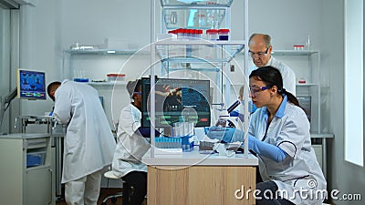 Professional team of scientists preparing vaccine against new virus Stock Photo