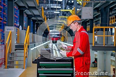 Professional technician worker with safety uniform check tools and equipment in the cabinet to prepare for check and maintenance Stock Photo