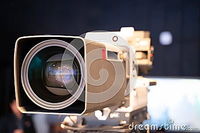 Professional television camera with large lens on a tripod during TV recording Editorial Stock Photo