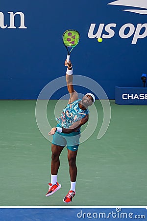 Professional tennis player Frances Tiafoe in a competitive US Open match Editorial Stock Photo