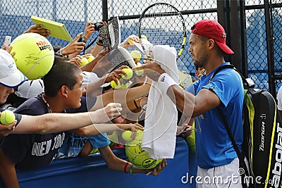 Professional tennis player Jo-Wilfried Tsonga signing autographs after practice for US Open 2014 Editorial Stock Photo