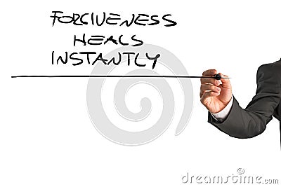 Professional therapist writing a Forgiveness heals instantly say Stock Photo