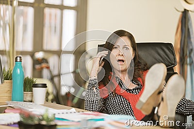 Professional Woman Reacting to Phone Conversation Stock Photo