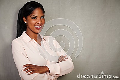 Professional woman smiling with arms crossed Stock Photo