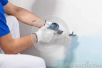 Professional Workman Applying Silicone Sealant With Caulking Gun Stock Photo