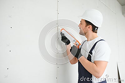 Professional Workman Applying Silicone Sealant With Caulking Gun on the Wall Stock Photo