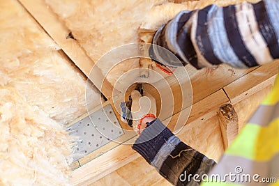 Professional workman using knife tool, cutting rockwool Stock Photo