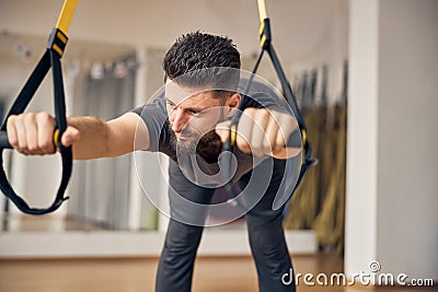 Professional young sportsman stretching his lower back Stock Photo