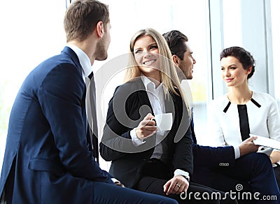 Professionals chatting during a coffee break Stock Photo