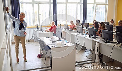 Back view of teacher in the classrom Stock Photo