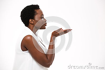 Profile of charming african american young woman sending a kiss Stock Photo