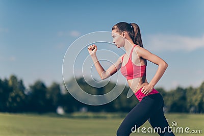 Profile cropped photo of young lady athlete, running outdoors, t Stock Photo