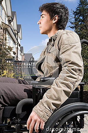 Profile of a disabled teenage boy Stock Photo