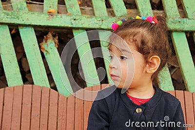 Profile of little girl with sad face looking away Stock Photo