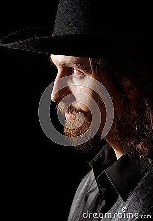Profile of man in hat Stock Photo