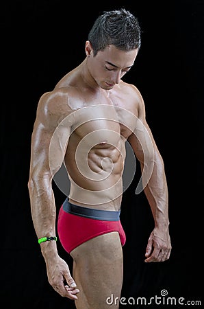 Profile of muscular bodybuilder relaxed Stock Photo