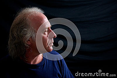 Profile of older man looking right Stock Photo